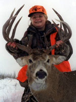 Mary Coombs holding her trophy - a 12 point Whitetail buck.